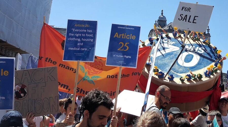 Article 25 placards: Everyone has the right to food, clothing, housing and medical care...