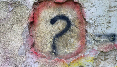 Question mark in colours on wall