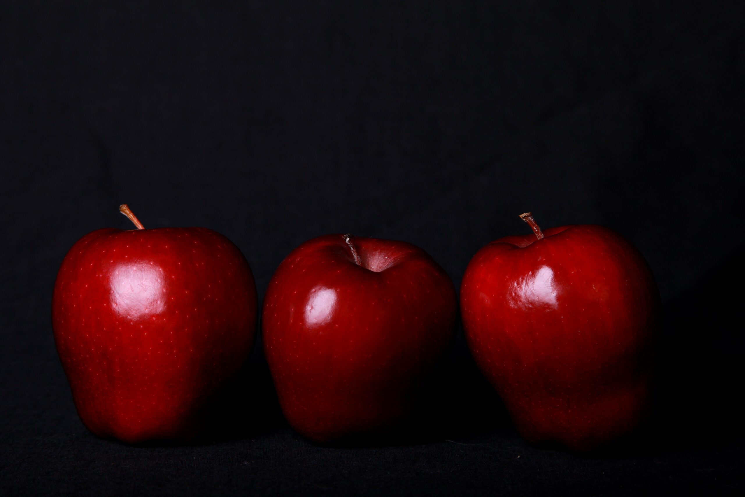 Three red apples