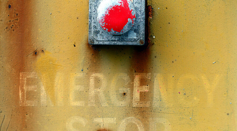 Emergency stop in capitals, decayed wall